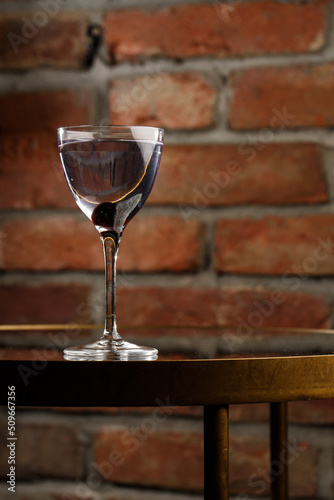 Obraz na płótnie Aviation, drink with gin, lemon juice, maraschino liqueur and violet cream liqueur standing on bar counter. w salonie