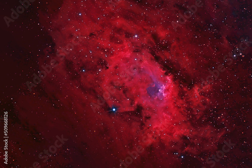 Beautiful galaxy of red color with stars. Elements of this image were furnished by NASA