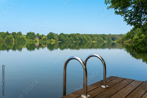 Jetty at the lake Großensee in Schleswig Holstein in the north of Germany. The lake belongs to the city of Hamburg, the high water quality is to ensure the water supply of the city