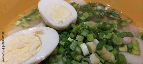 ramen with egg, herbs, noodles. Close-up. Soup.