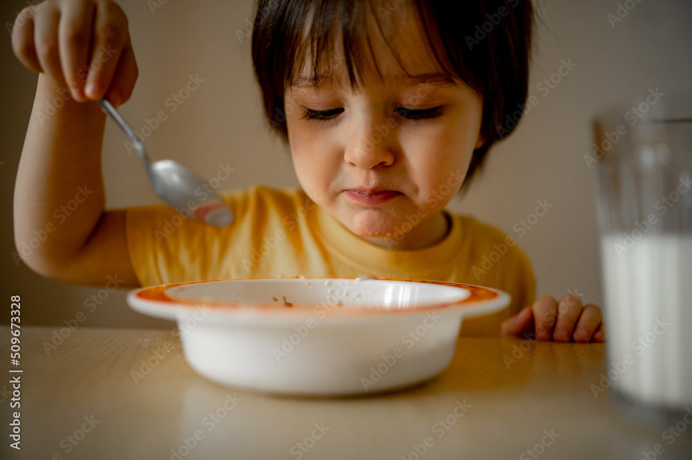 a child eats porridge for breakfast and drinks milk a child eats porridge for breakfast and drinks milk