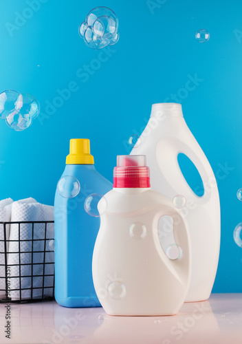 Slika na platnu A set of bottles with gel for washing clothes with flying soap bubbles