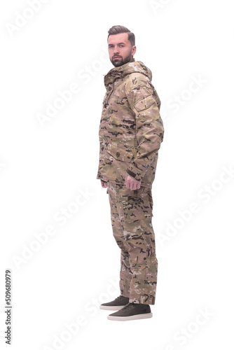 in full growth. a man in autumn camouflage . isolated on white