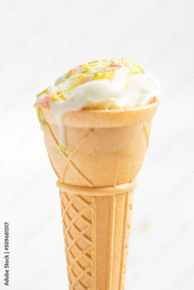 ice cream cone on white background and sugar particles on it ice cream cone on white background and sugar particles on it