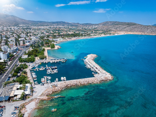 Fototapeta Naklejka Na Ścianę i Meble -  Aerial view of the marina and beach at Varkiza, south Athens luxury suburb, Greece, with clear, emerald sea and sand beaches