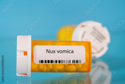 Nux vomica. Nux vomica pills in RX prescription drug bottle photo