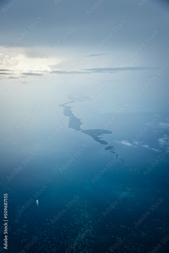 Aerial view of an Island with a few clouds