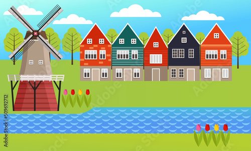 Dutch countryside. Famous symbol of Holland, windmill  with beautiful nature and houses