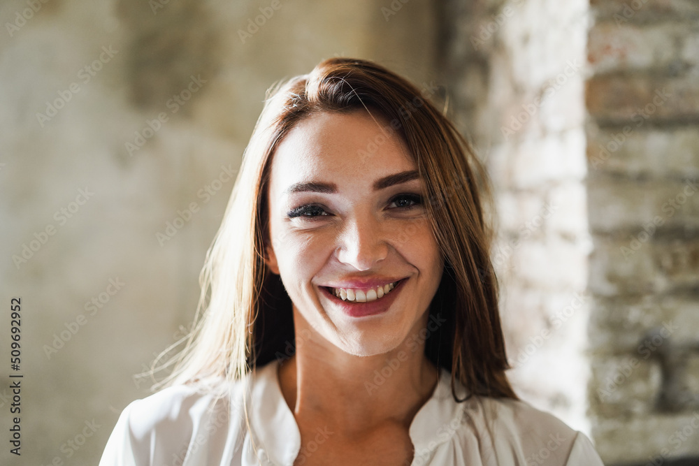 Young business woman working inside modern office - Focus on face