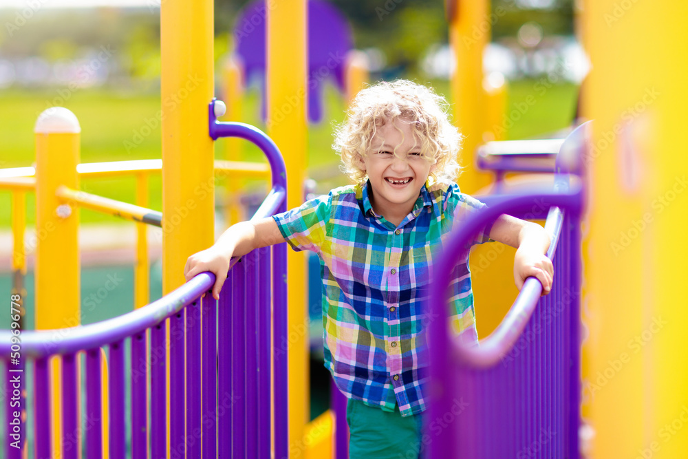 Obraz premium Child on playground. Kids play outdoor.