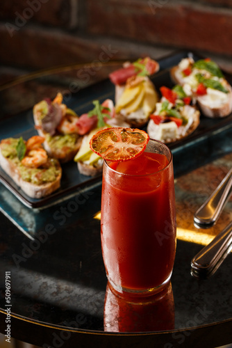 Obraz na płótnie Bruschettas with vegetables. Start dishes with cherry tomatoes, avocado, cream cheese and shrimps. Food composition, tasty italian meal w salonie