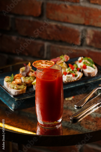 Obraz na płótnie Bruschettas with vegetables. Start dishes with cherry tomatoes, avocado, cream cheese and shrimps. Food composition, tasty italian meal w salonie
