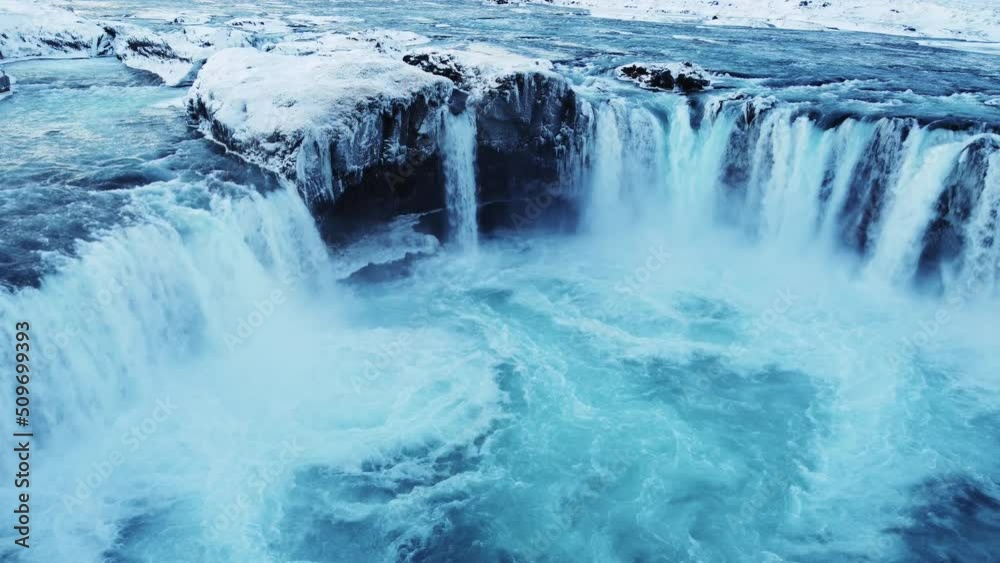 Spectacular aerial drone shot of mighty Godafoss waterfall in North Iceland during icy winter day. Famous landmark, Untouched arctic landscape Spectacular aerial drone shot of mighty Godafoss waterfall in North Iceland during icy winter day. Famous landmark, Untouched arctic landscape