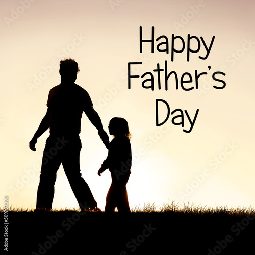 Silhouette of Christian Father Guiding his Young Child by the Ha