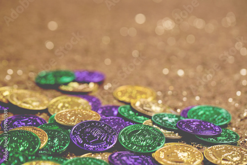 Mardi Gras Doubloons on a Gold Glitter Background