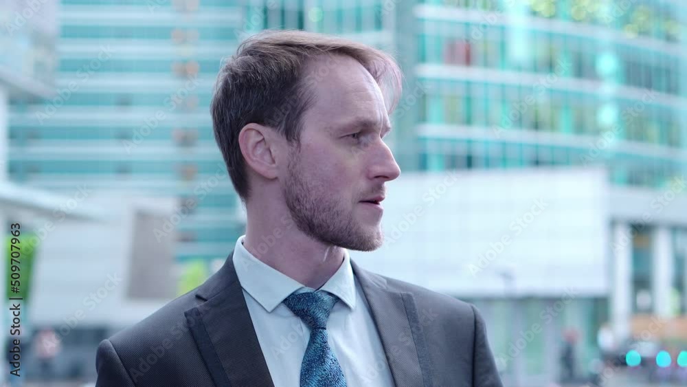 Close up Portrait of Handsome Man with, skyscrape facade on background, business city view. The concept of consulting. Close up Portrait of Handsome Man with, skyscrape facade on background, business city view. The concept of consulting.