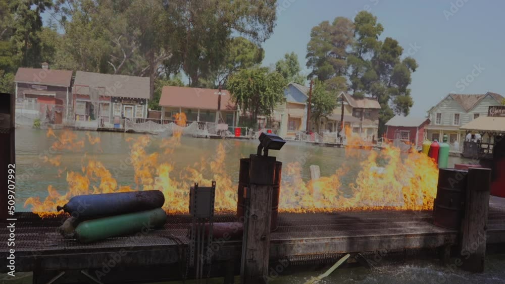 This video shows a lakeside dock on fire in slow motion. This video shows a lakeside dock on fire in slow motion.