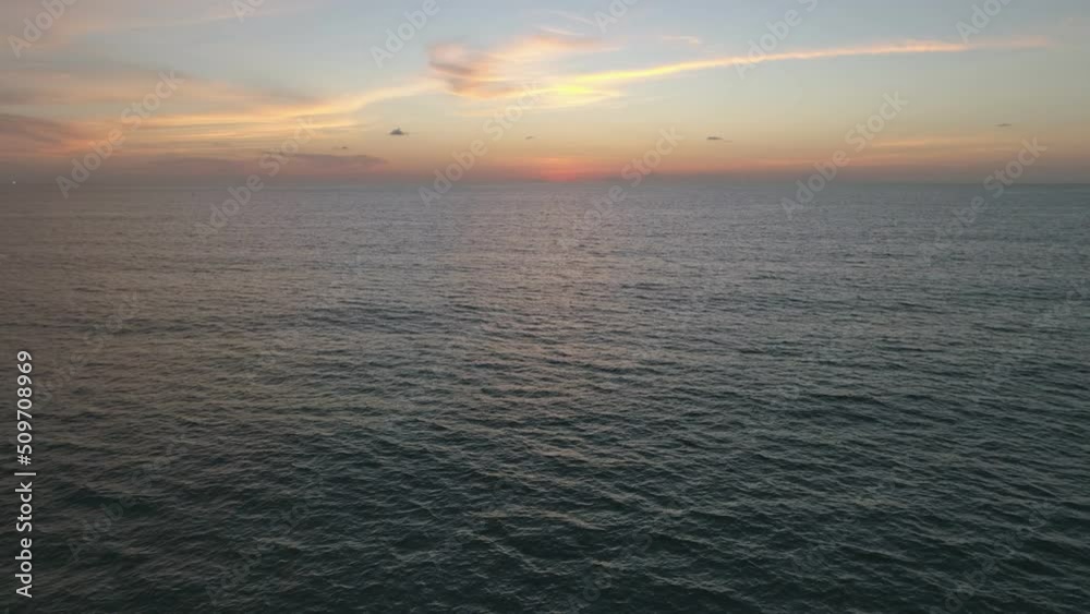Aerial view Beautiful view sunset or sunrise over sea surface beautiful wave Amazing light twilight sky sunset. Cinematic drone shot dynamic footage beautiful light of nature seascape Aerial view Beautiful view sunset or sunrise over sea surface beautiful wave Amazing light twilight sky sunset. Cinematic drone shot dynamic footage beautiful light of nature seascape