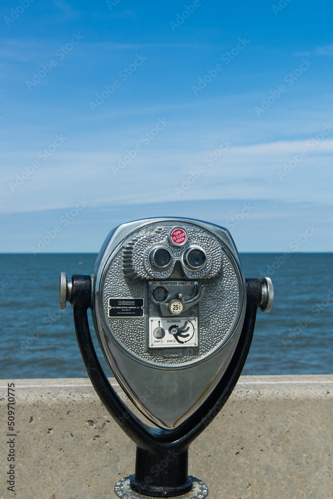 Coin binoculars close-up on the shore of the Atlantic Ocean. Coin binoculars close-up on the shore of the Atlantic Ocean.