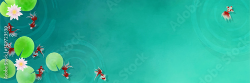 睡蓮の浮かぶ池で泳ぐ複数の赤い金魚