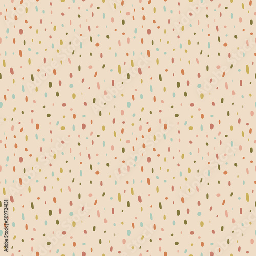 Colorful organic speckle seamless vector pattern. Rainbow earth tone colored irregular dots on a natural beige background. Modern, fun, abstract confetti design. Creative repeat backdrop texture. 