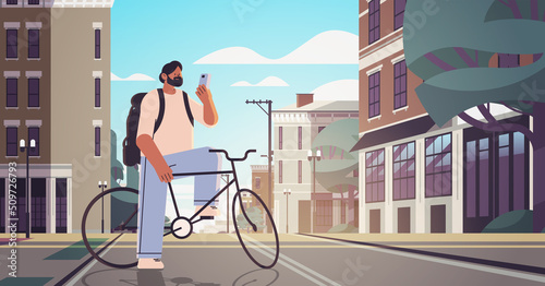 young man with bike using smartphone sportsman riding bicycle workout healthy lifestyle digital addiction concept