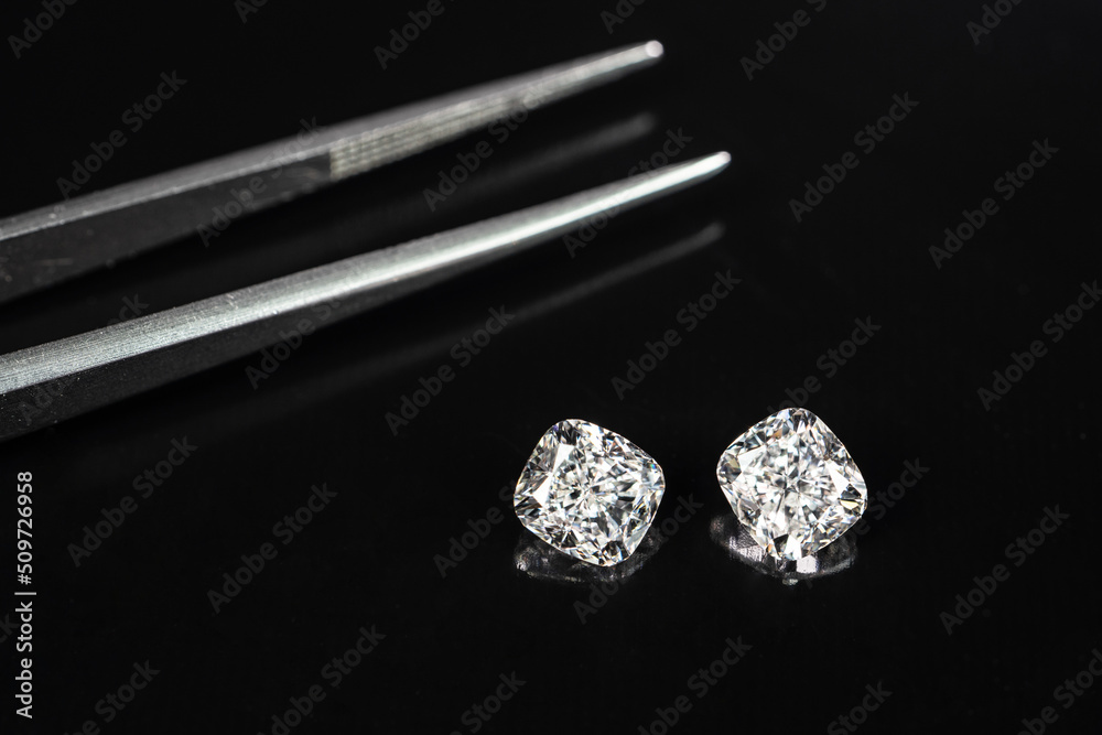 Cushion cut diamonds 1.50ct. compare with tweezers Cushion cut diamonds 1.50ct. compare with tweezers