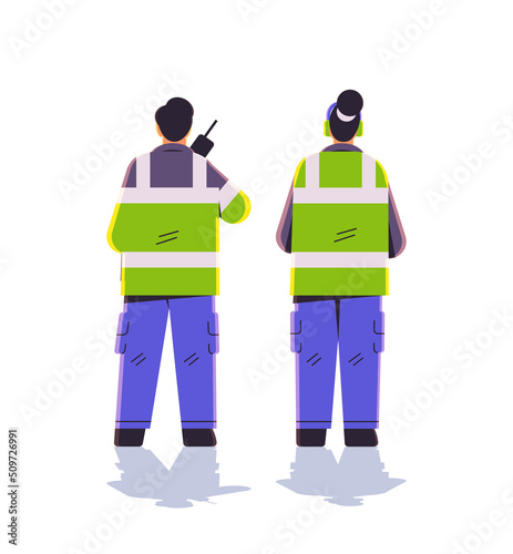 aviation marshallers in uniform using walkie talkie air traffic controllers airline worker in signal vests professional airport staff