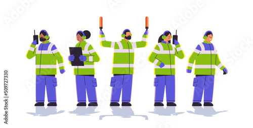 aviation marshallers supervisors team in uniform air traffic controllers airline worker in signal vests professional airport staff