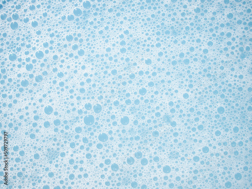 Wallpaper Mural View of soap bubble foam on blue water background Torontodigital.ca