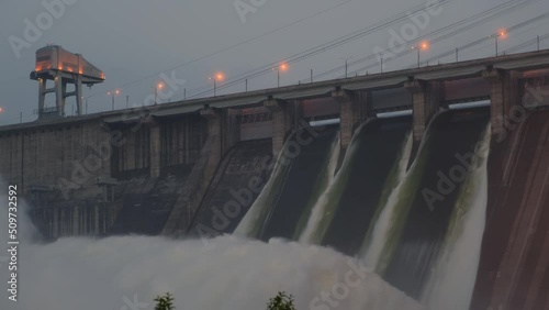 Hydroelectric dam top view. Discharge of water at hydroelectric power plants. Big waterfall. Electricity. Krasnoyarsk hydroelectric power station. Yenisei river.