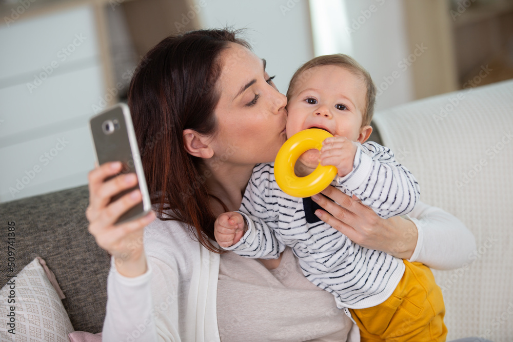 young mother with little son taking selfie young mother with little son taking selfie