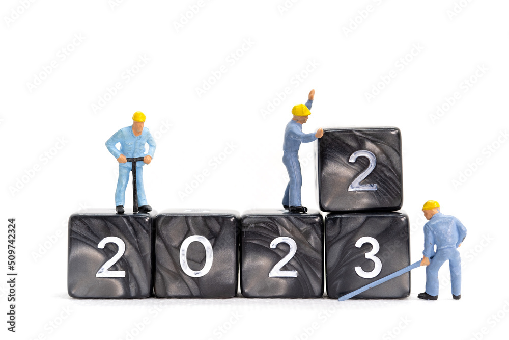 Miniature People Worker Team Create Number 2023 On Block , Happy New Year Concept
