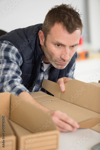wokman constructing a cardboard box photo