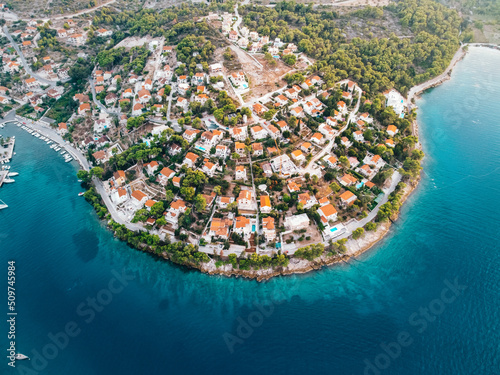 Beautiful villages Splitska on island Brac Croatia Aerial view Crystal blue waterAdriatic sea