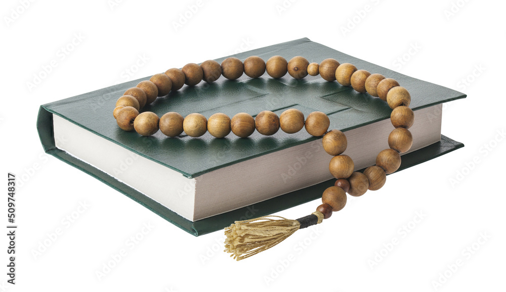 Old bible and wooden rosary isolated on white background. Old bible and wooden rosary isolated on white background.