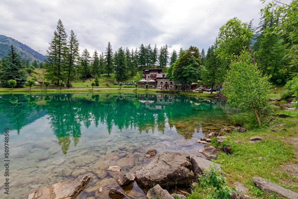 View of Laux lake, small alpine lake near Usseaux, in Val Chisone, Piedmont, Italy View of Laux lake, small alpine lake near Usseaux, in Val Chisone, Piedmont, Italy