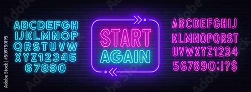 Start again neon sign on a brick background. photo