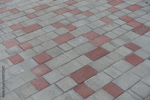 pavement made of simple pink and grey concrete blocks
