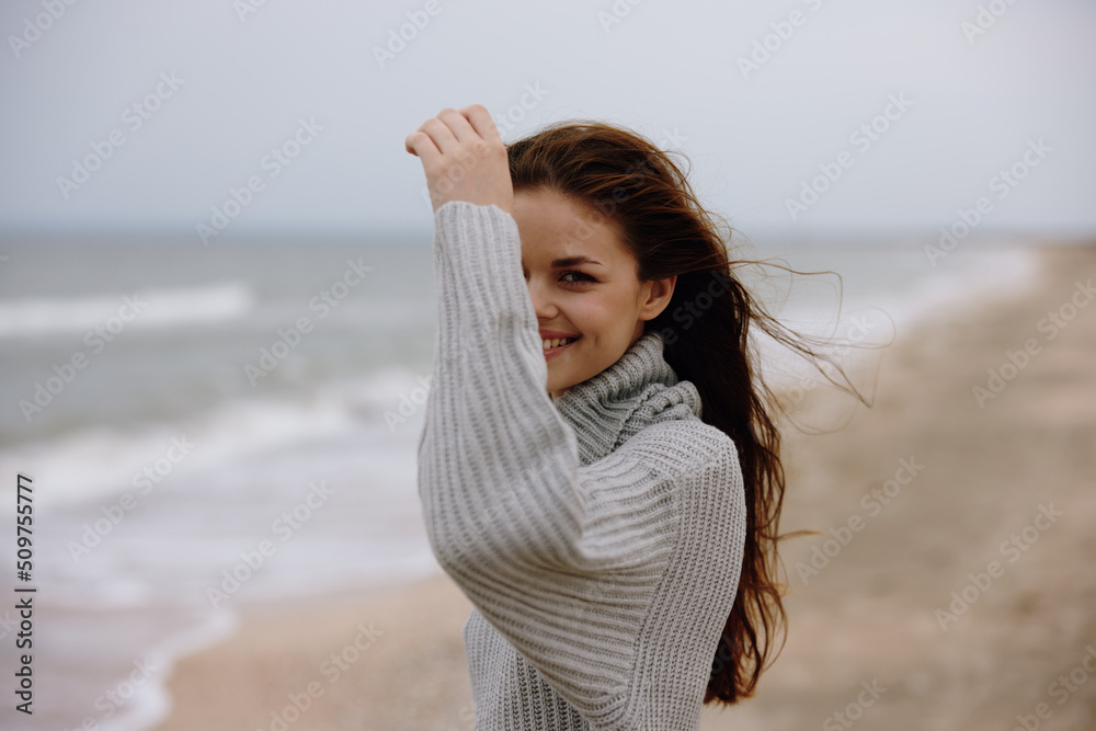 woman cloudy weather by the sea travel fresh air Relaxation concept woman cloudy weather by the sea travel fresh air Relaxation concept