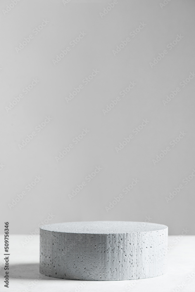 Empty stone podium on gray scene
