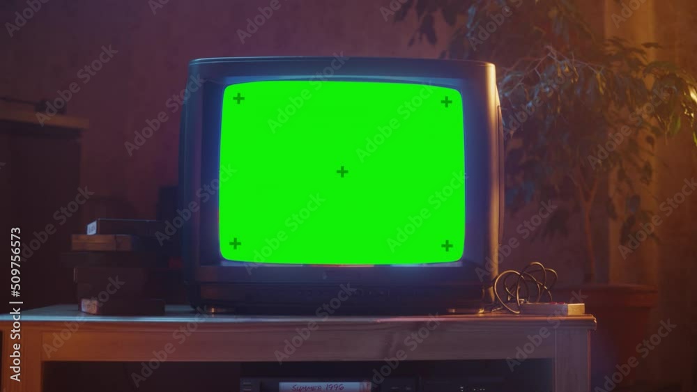 Close Up Footage of a Dated TV Set with Green Screen Mock Up Chroma Key Template Display. Nostalgic Retro Nineties Technology Concept.