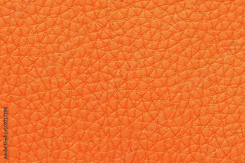 Natural, artificial orange leather texture background. Material for sport items, clothes, furnitre and interior design. ecological friendly leatherette.