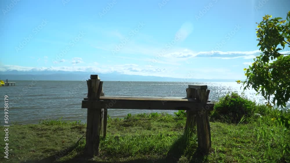 Clear skies and turquoise waters and chairs by the sea. Clear skies and turquoise waters and chairs by the sea.