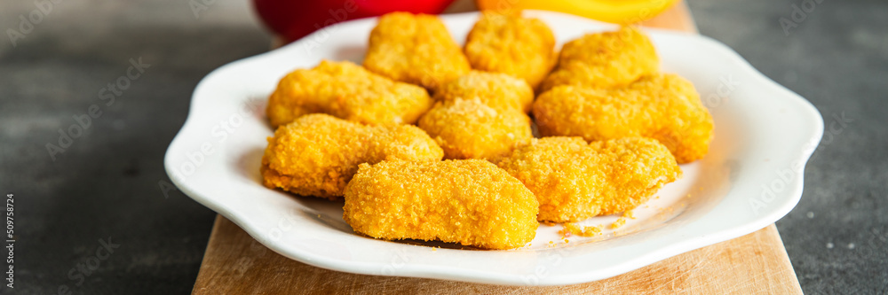 chicken nuggets deep fried poultry meat fresh healthy meal food snack diet on the table copy space food background rustic top view chicken nuggets deep fried poultry meat fresh healthy meal food snack diet on the table copy space food background rustic top view