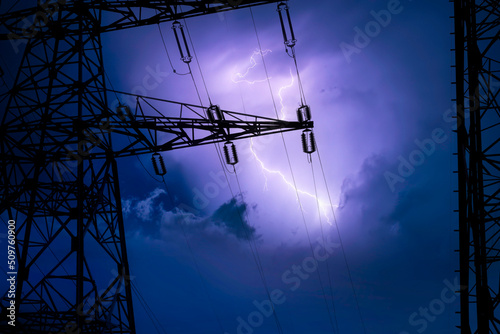 High voltage cable tower in a lightning storm