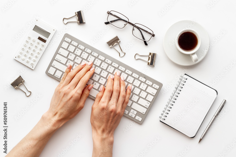 Female hands working on office table. Monochrome design work space Female hands working on office table. Monochrome design work space