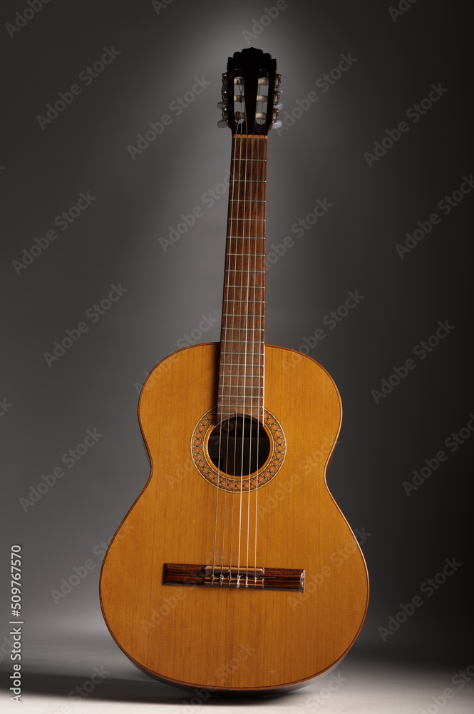 Classical guitar on grey background with copy space