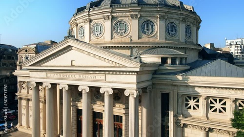 Aerial drone view of Romanian Athenaeum in Bucharest, Romania. Main building entrance, multiple buildings around photo