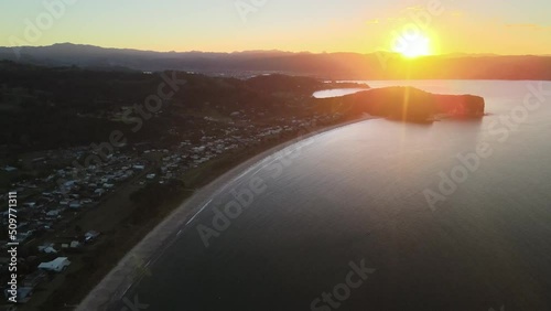 watching the sun drop behind the horizon in Coromandel Peninsula  photo